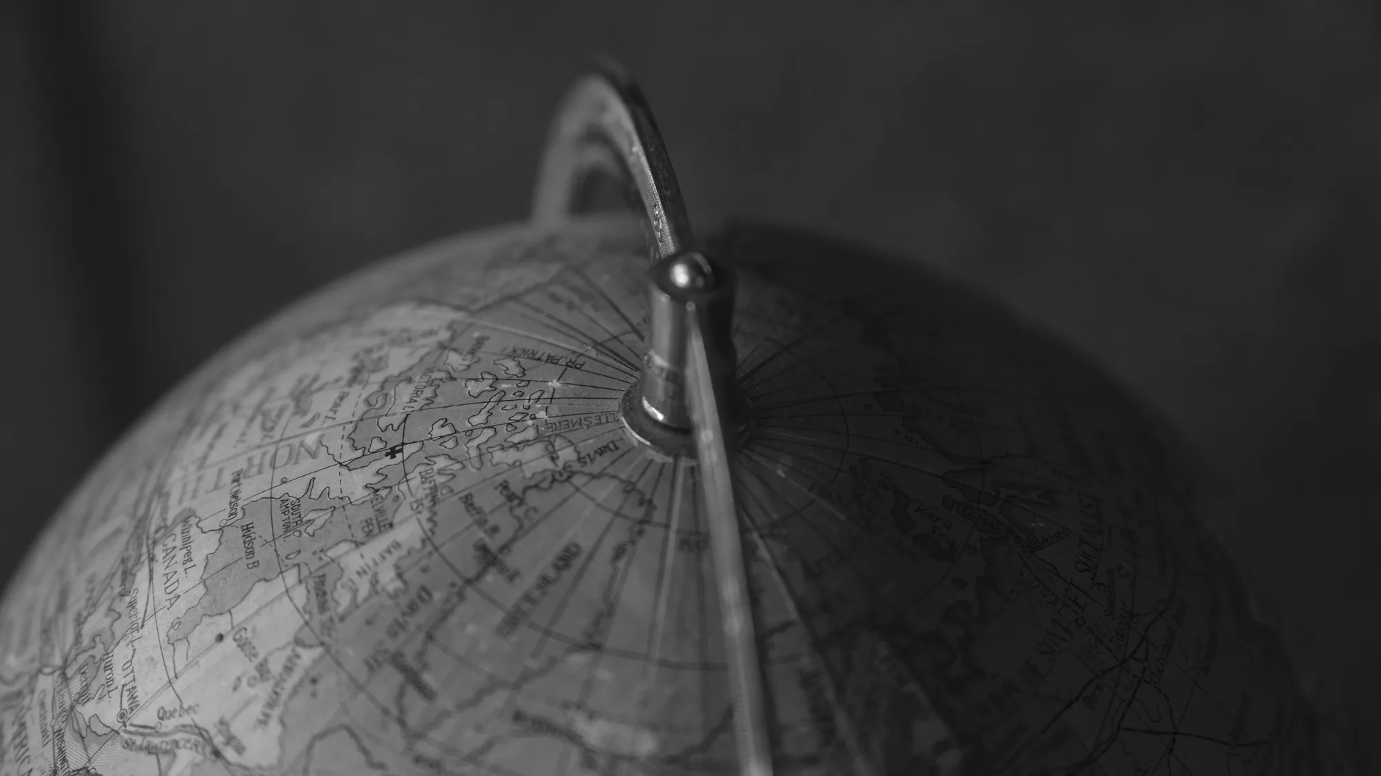 Monochrome close-up of a vintage world globe