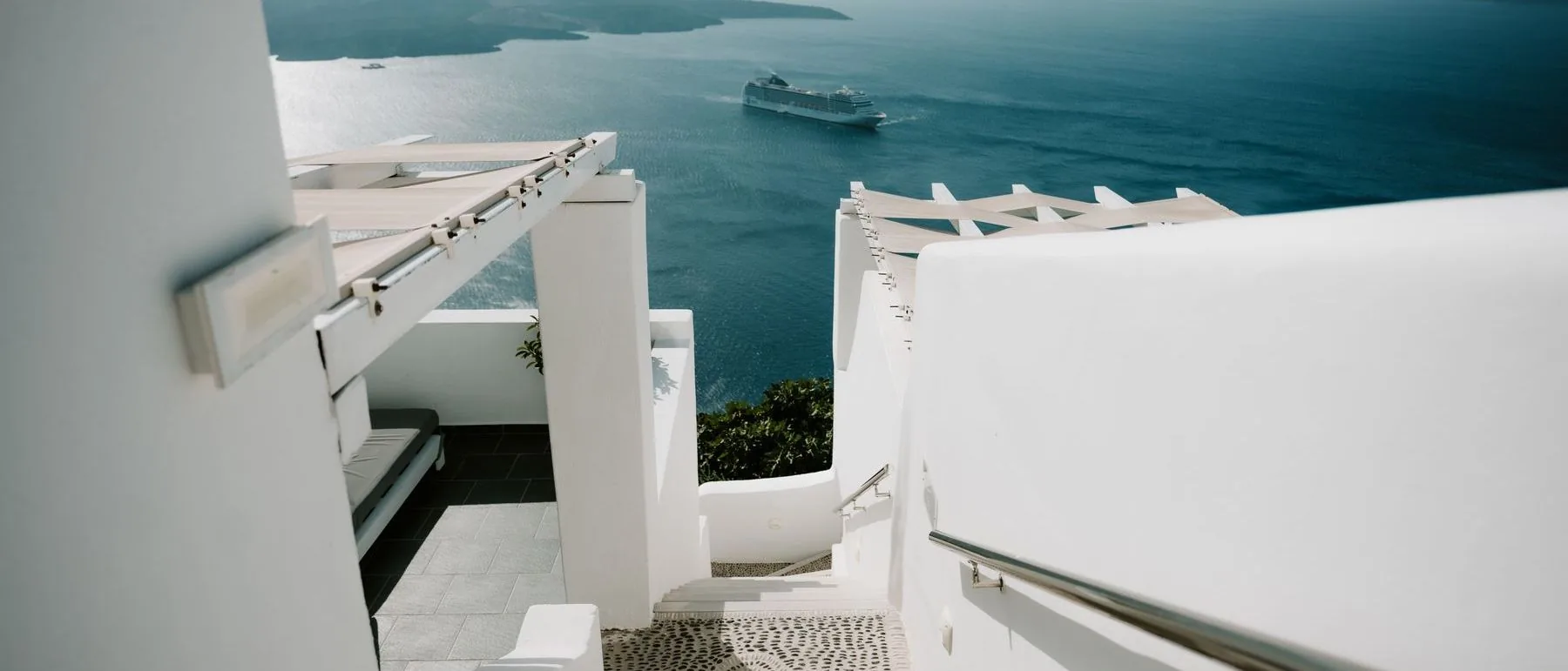 Whitewashed Greek island architecture overlooking the Aegean sea