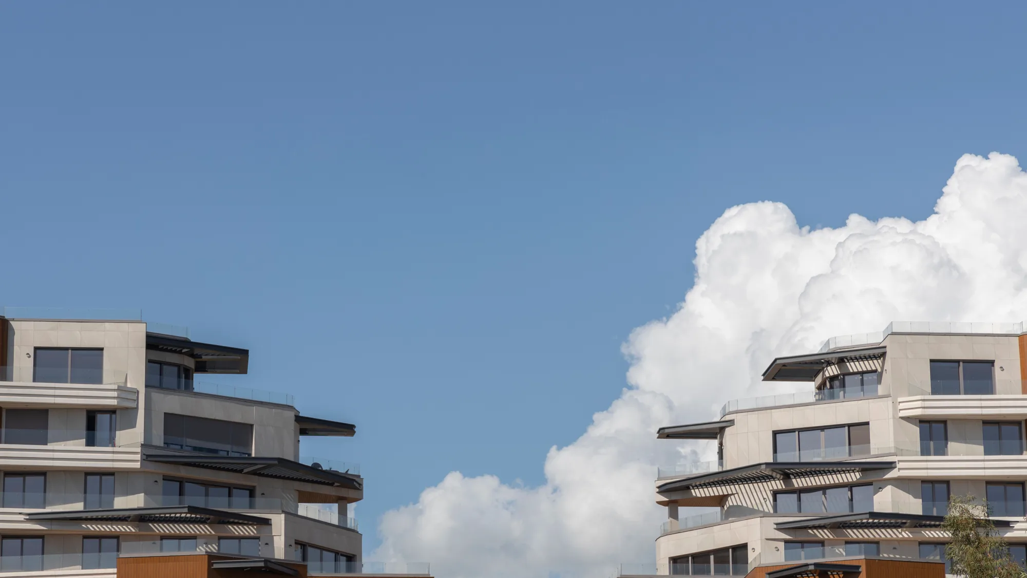 Modern residential apartment buildings against a clear sky