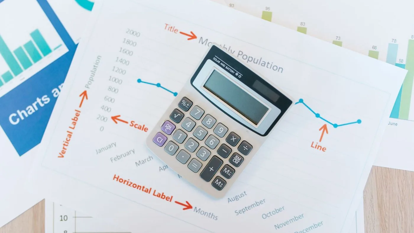 Calculator and financial documents during a property assessment